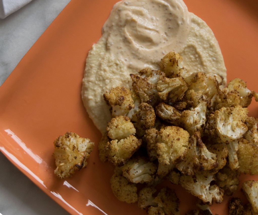 Middle Eastern Spicy Roasted Cauliflower over Hummus and Spicy Greek Yogurt Fete-a-Tete 